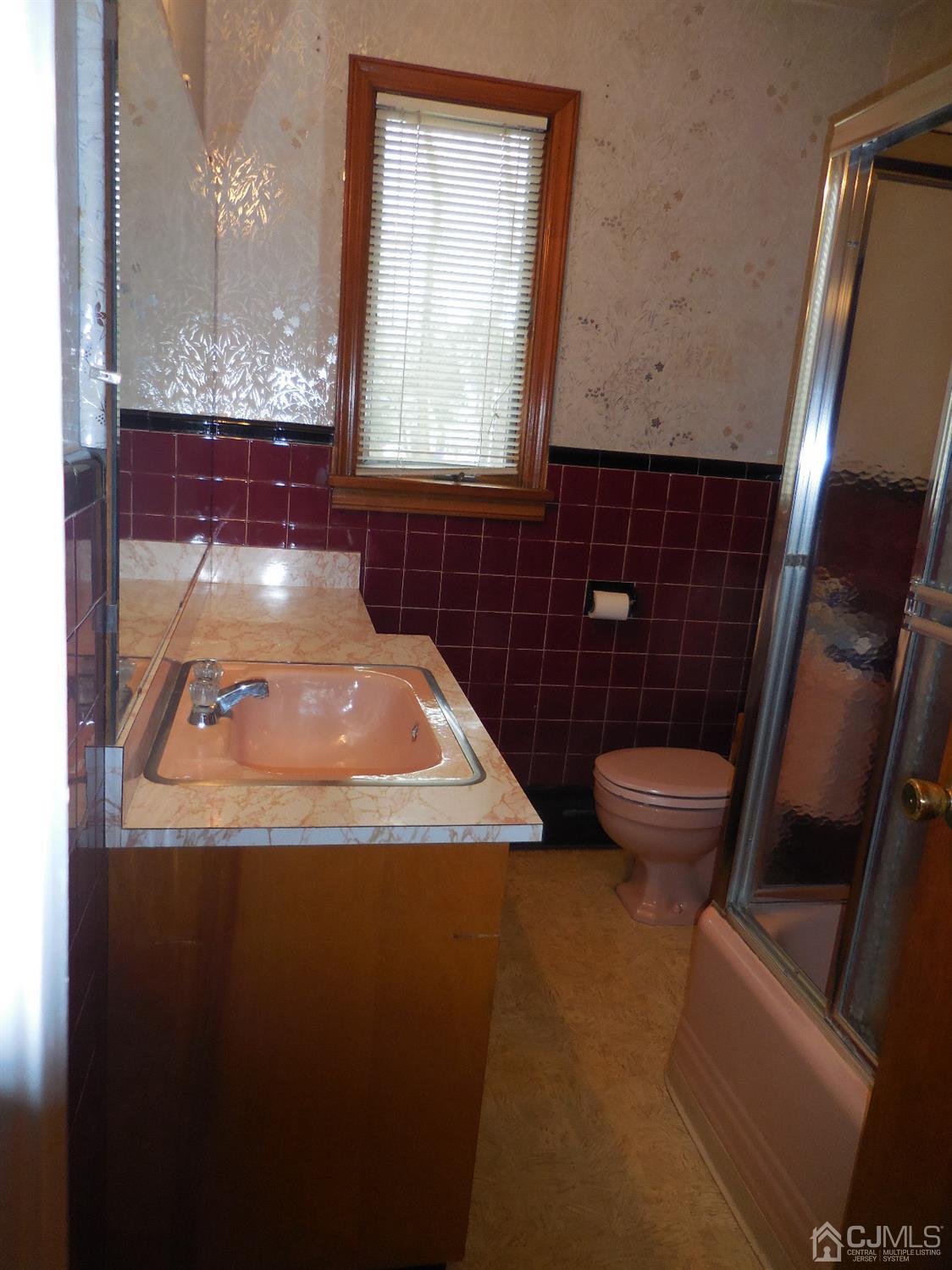 276 Carber Street Bound Brook, NJ 08805 - Photo 24 of 36 a bathroom with a sink and a toilet