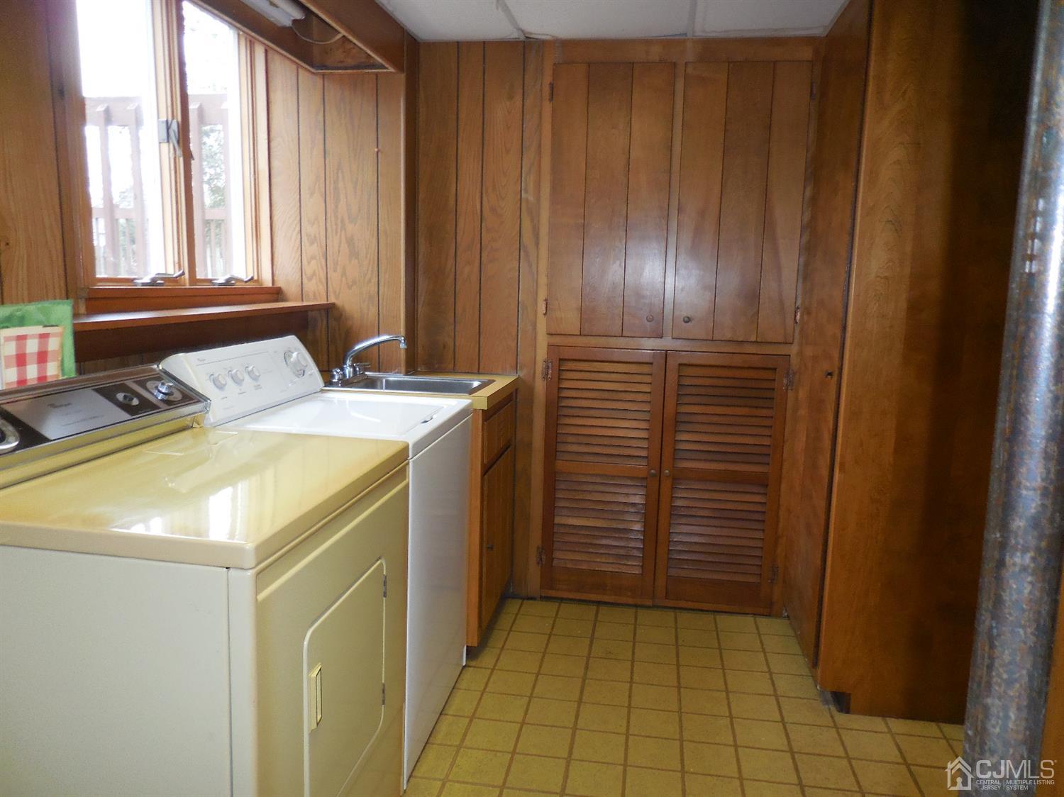 276 Carber Street Bound Brook, NJ 08805 - Photo 31 of 36 a utility room with a sink