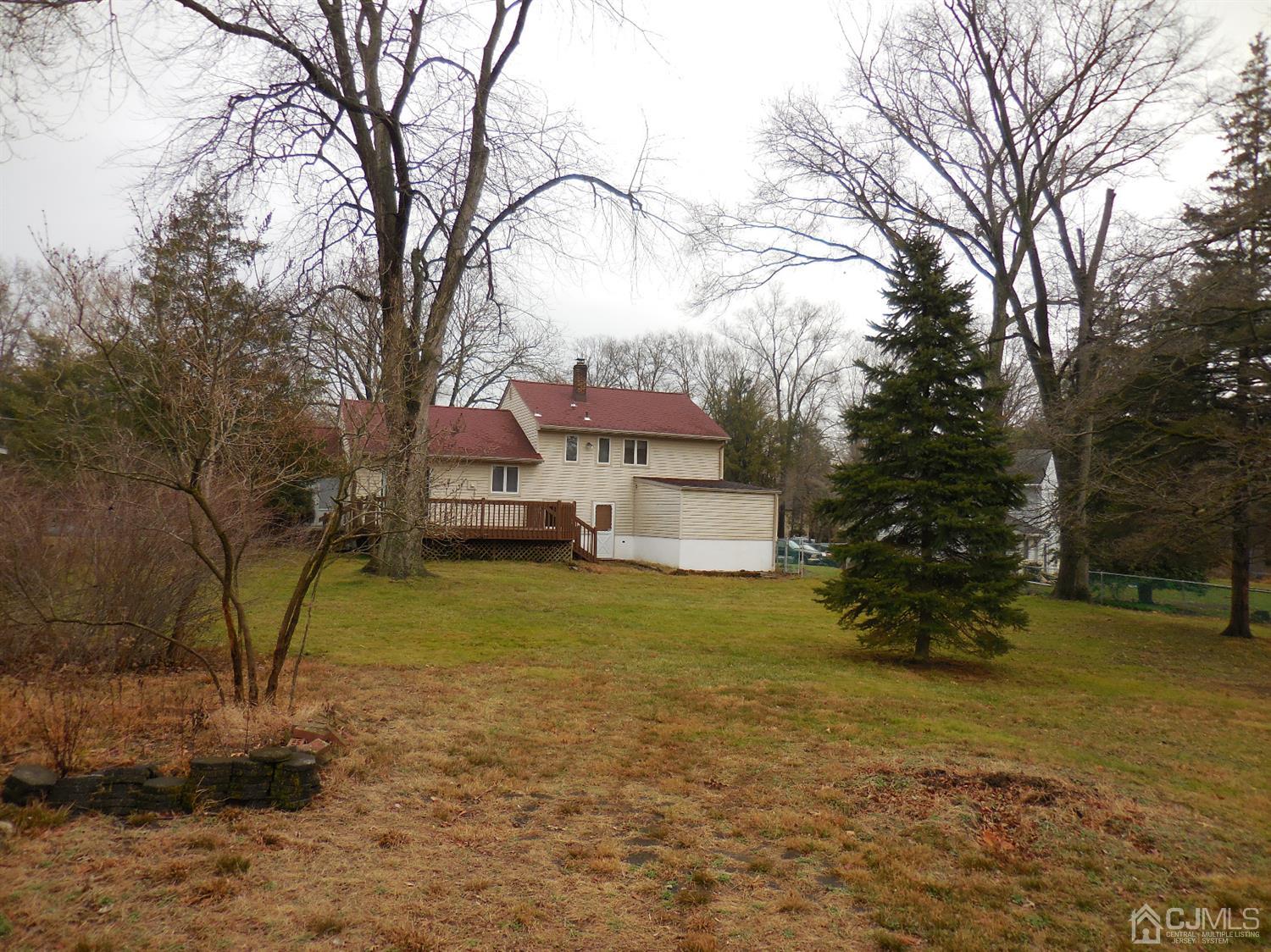 276 Carber Street Bound Brook, NJ 08805 - Photo 34 of 36 a house with trees in front of it