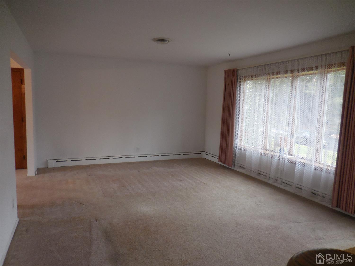 276 Carber Street Bound Brook, NJ 08805 - Photo 5 of 36 a view of an empty room with a window