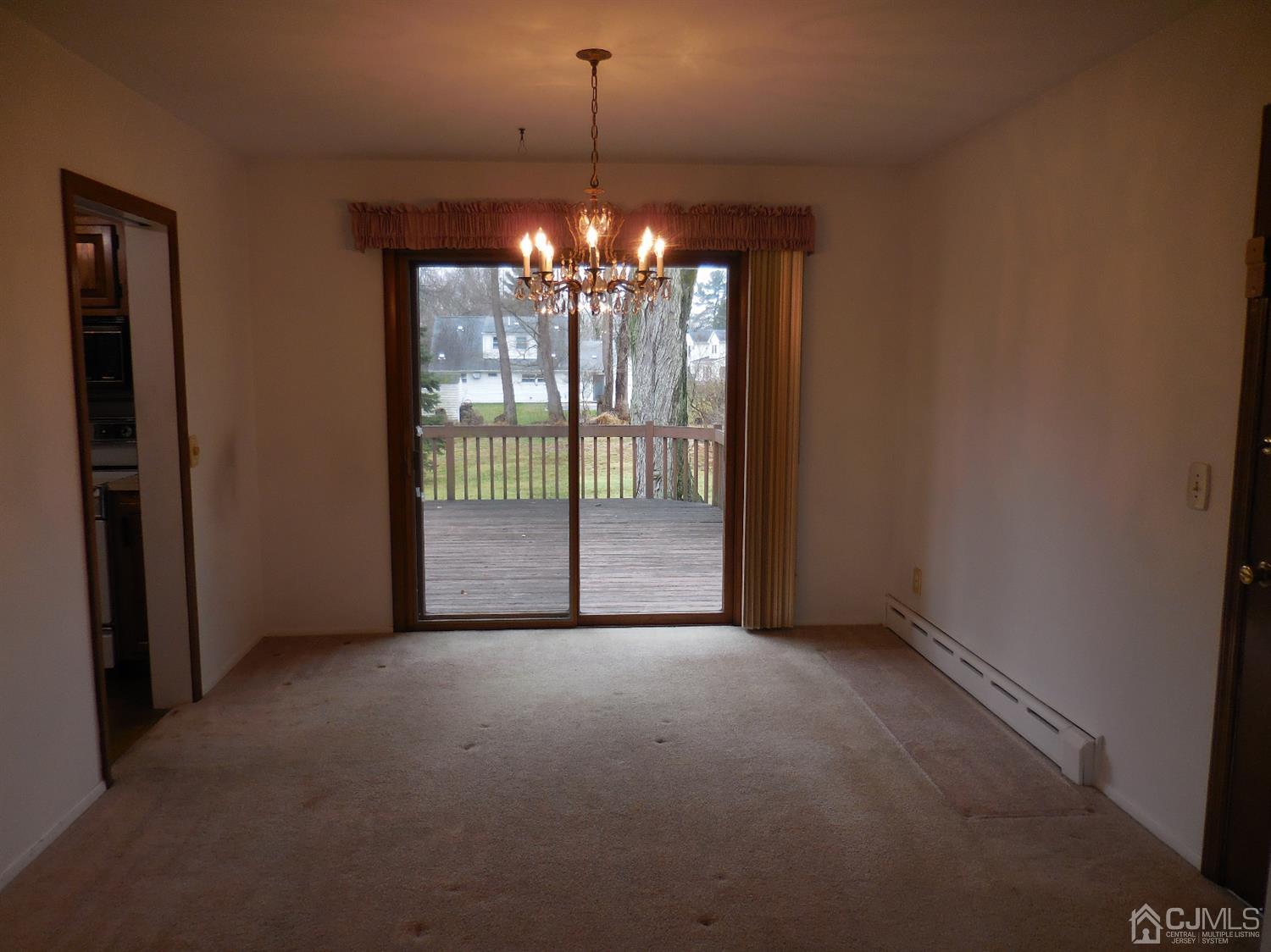 276 Carber Street Bound Brook, NJ 08805 - Photo 8 of 36 a view of an empty room with windows