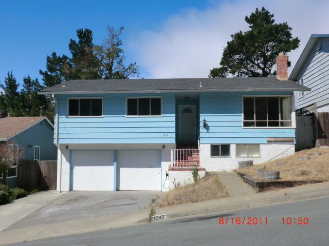 a front view of a house with a garage