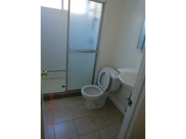 1247 Aspen Drive Pacifica, CA 94044 - Photo 7 of 12 a bathroom with a toilet and a mirror