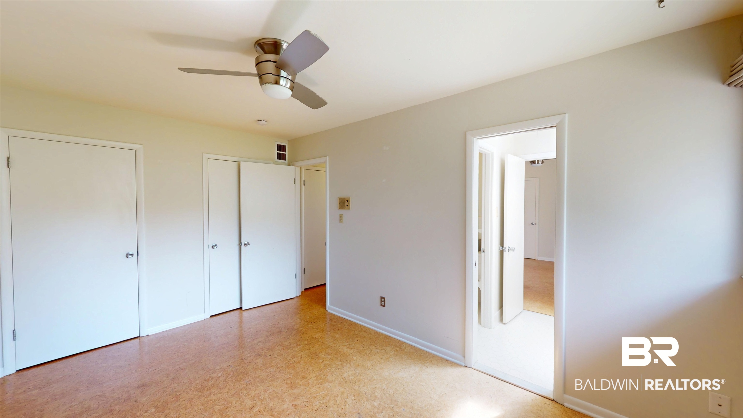 15 Spring Bank Road Mobile, AL 36608 - Photo 42 of 58 Unfurnished bedroom with two closets, a ceiling fan, and light flooring