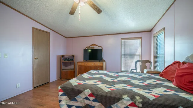 a view of walk in closet with clothes