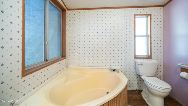 a kitchen with stainless steel appliances a refrigerator and a stove top oven