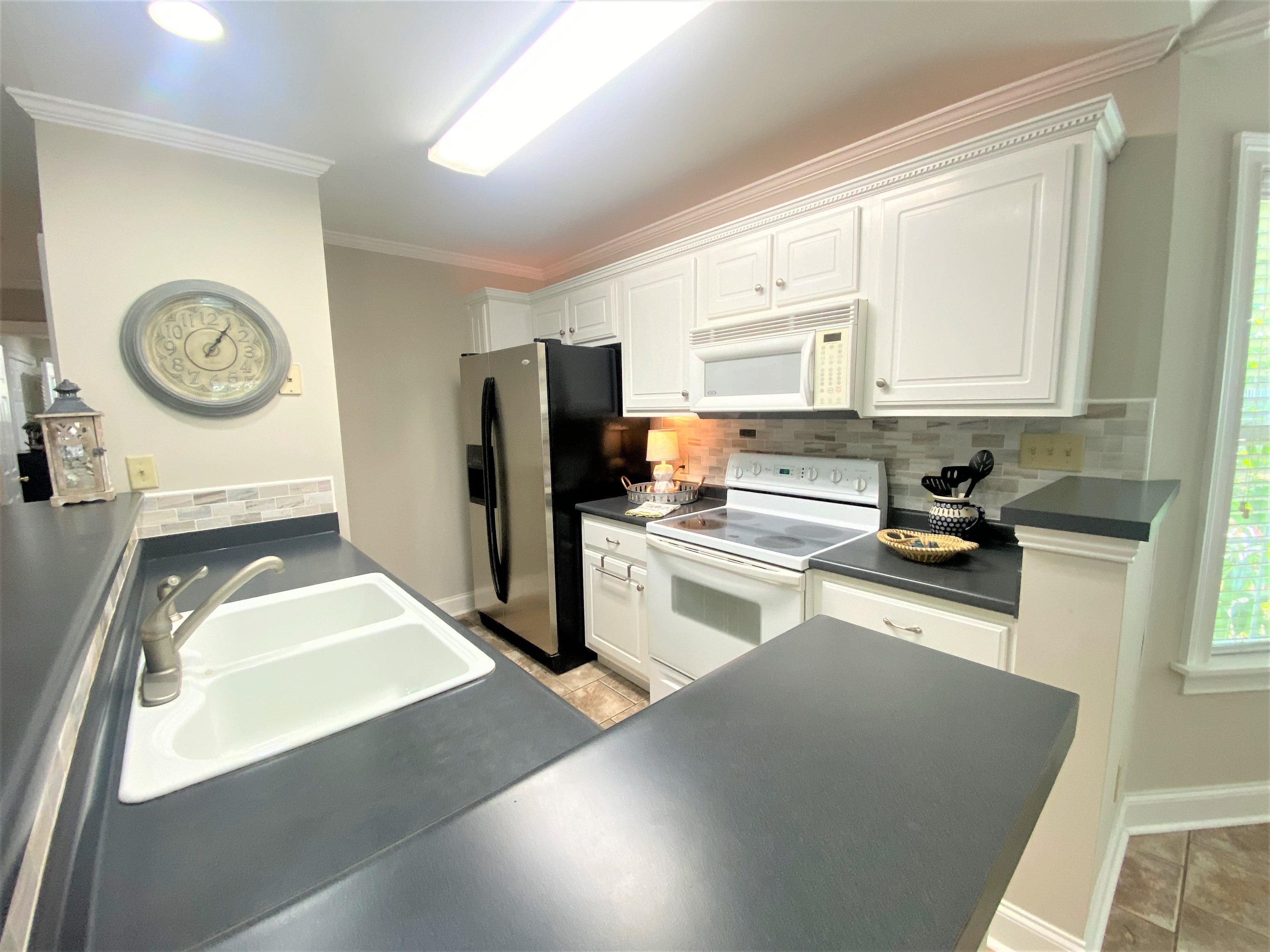 4 Patsy Path Iuka, MS 38852 - Photo 11 of 25 a kitchen with a refrigerator a stove top oven a sink and dishwasher