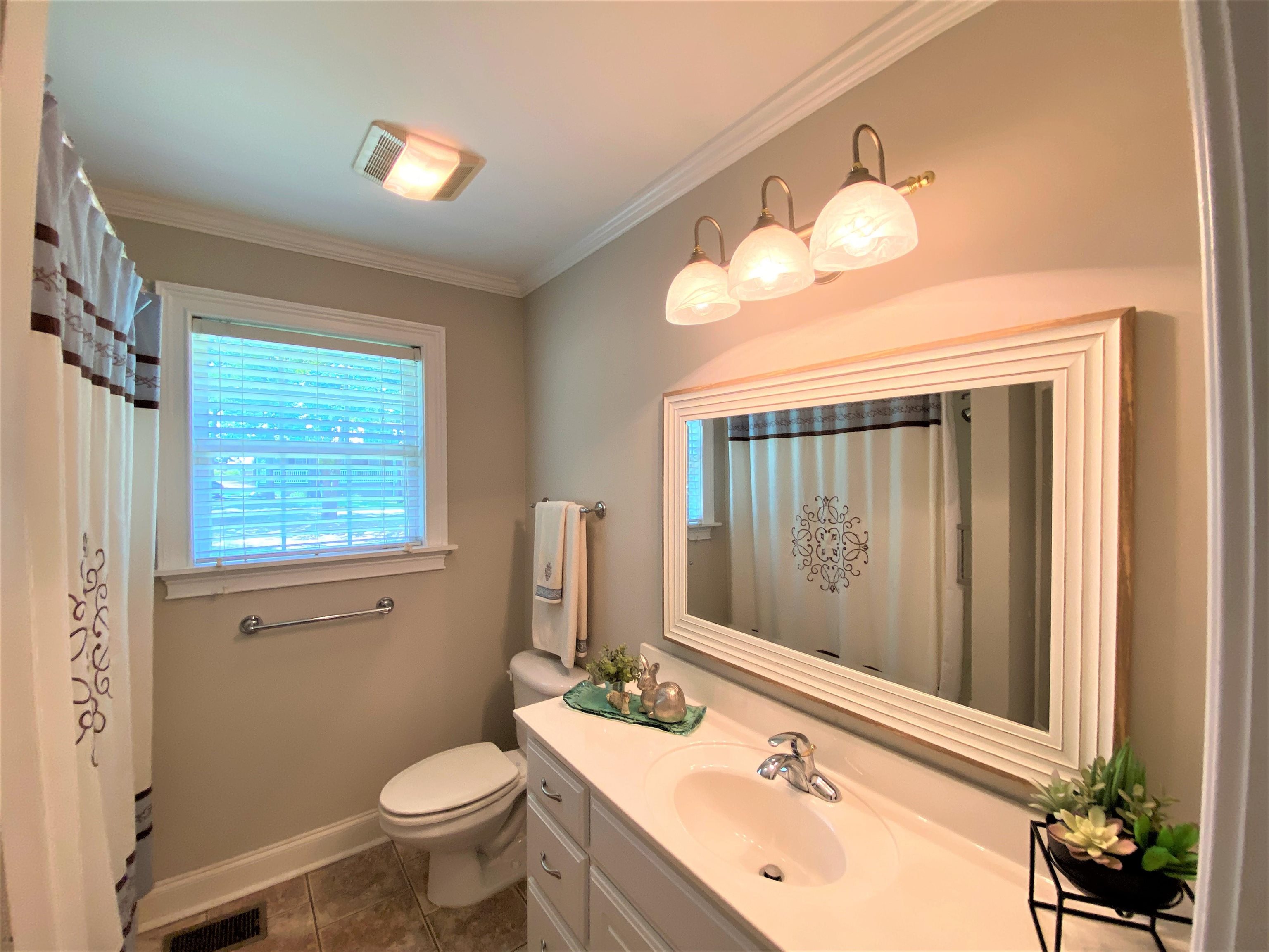 4 Patsy Path Iuka, MS 38852 - Photo 15 of 25 a bathroom with a sink vanity mirror and toilet