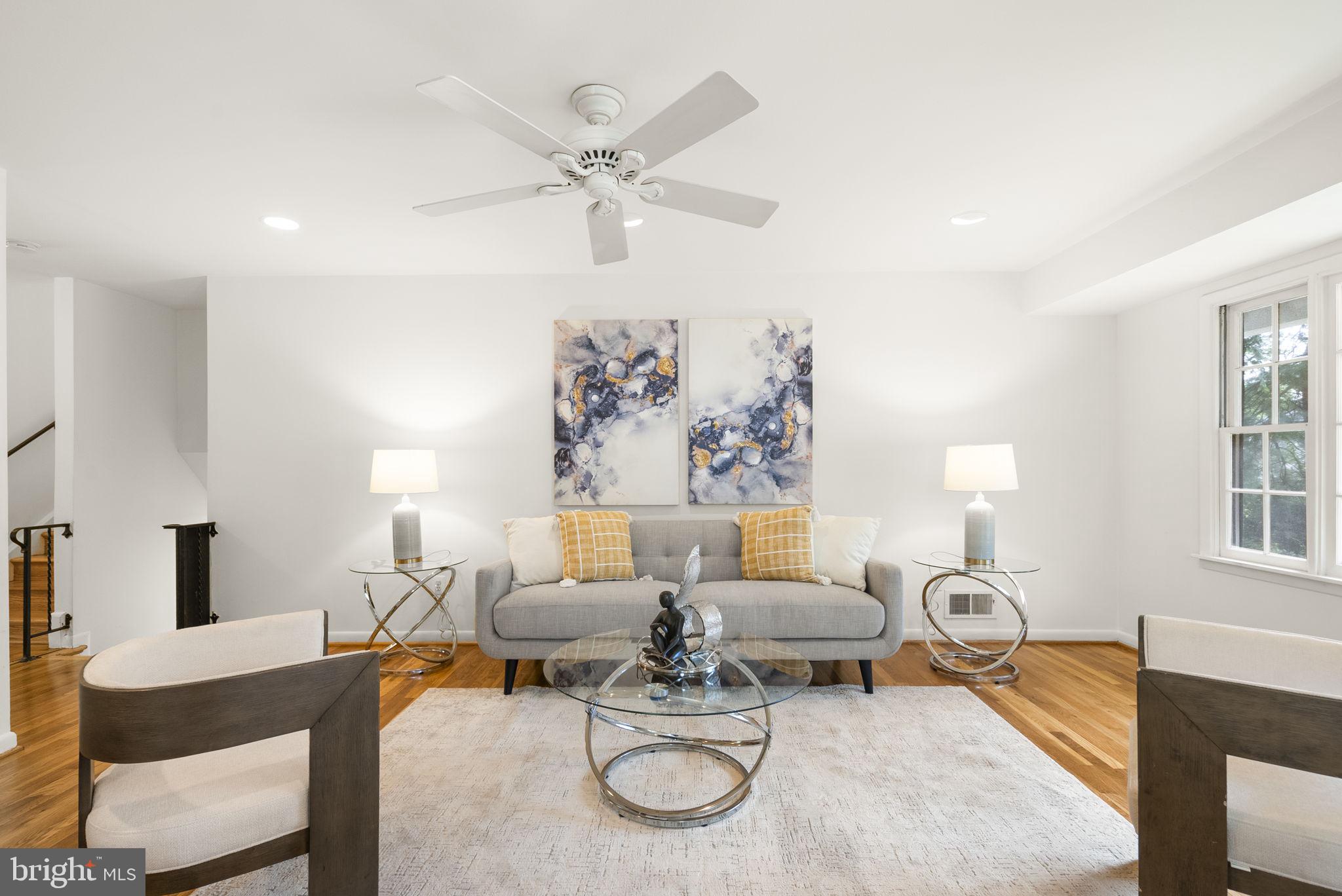 1503 Leister Drive Silver Spring, MD 20904 - Photo 11 of 58 a living room with furniture a fireplace and a table