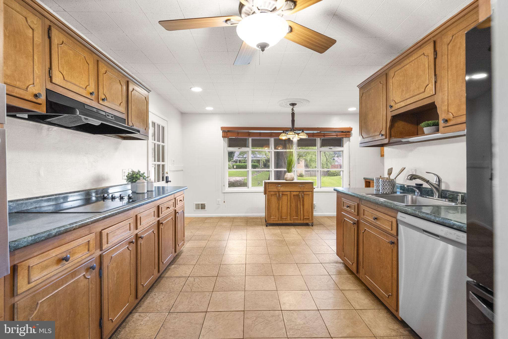 1503 Leister Drive Silver Spring, MD 20904 - Photo 15 of 58 a kitchen with stainless steel appliances granite countertop a stove a sink and a refrigerator