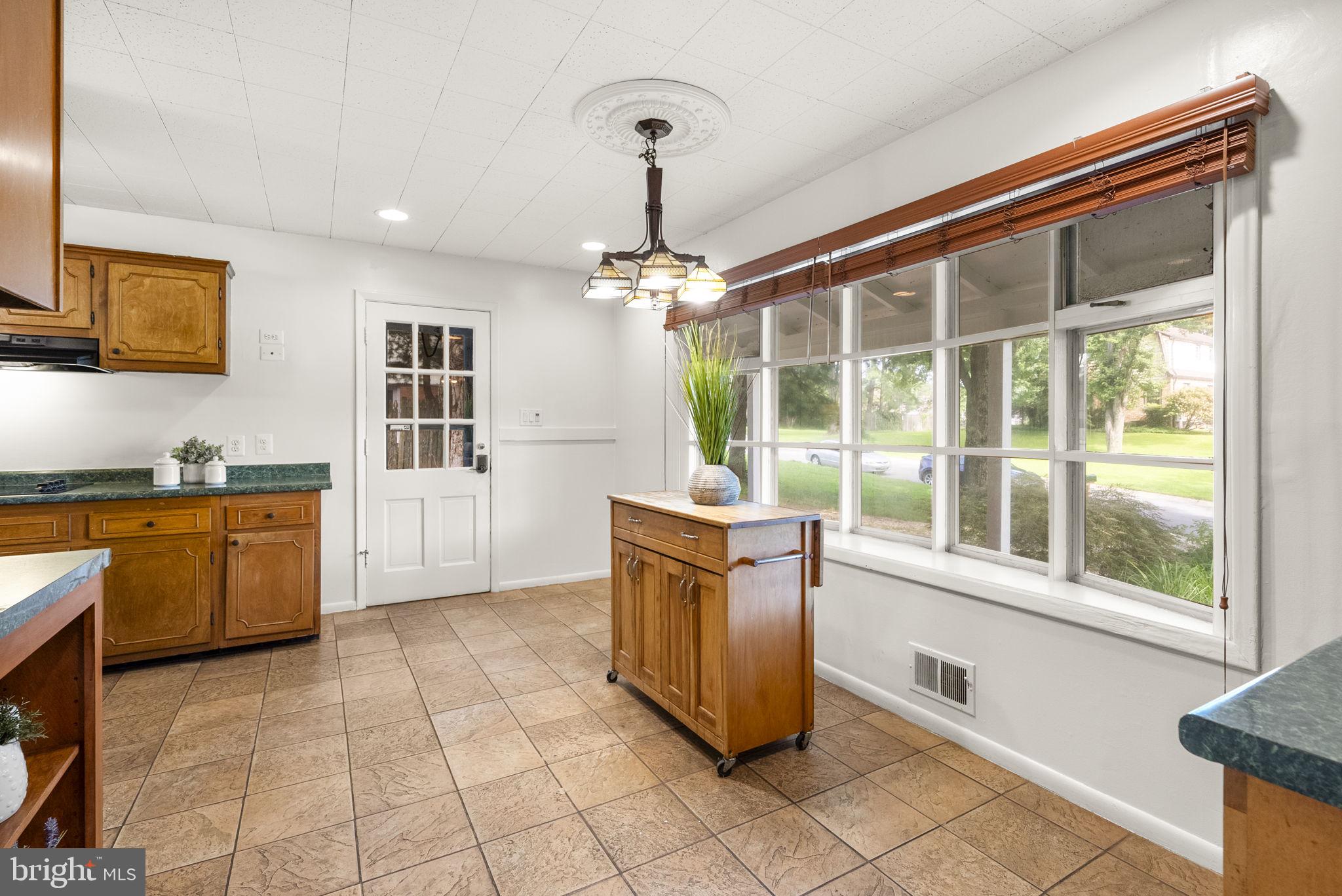 1503 Leister Drive Silver Spring, MD 20904 - Photo 21 of 58 a kitchen with granite countertop a stove a sink and a refrigerator