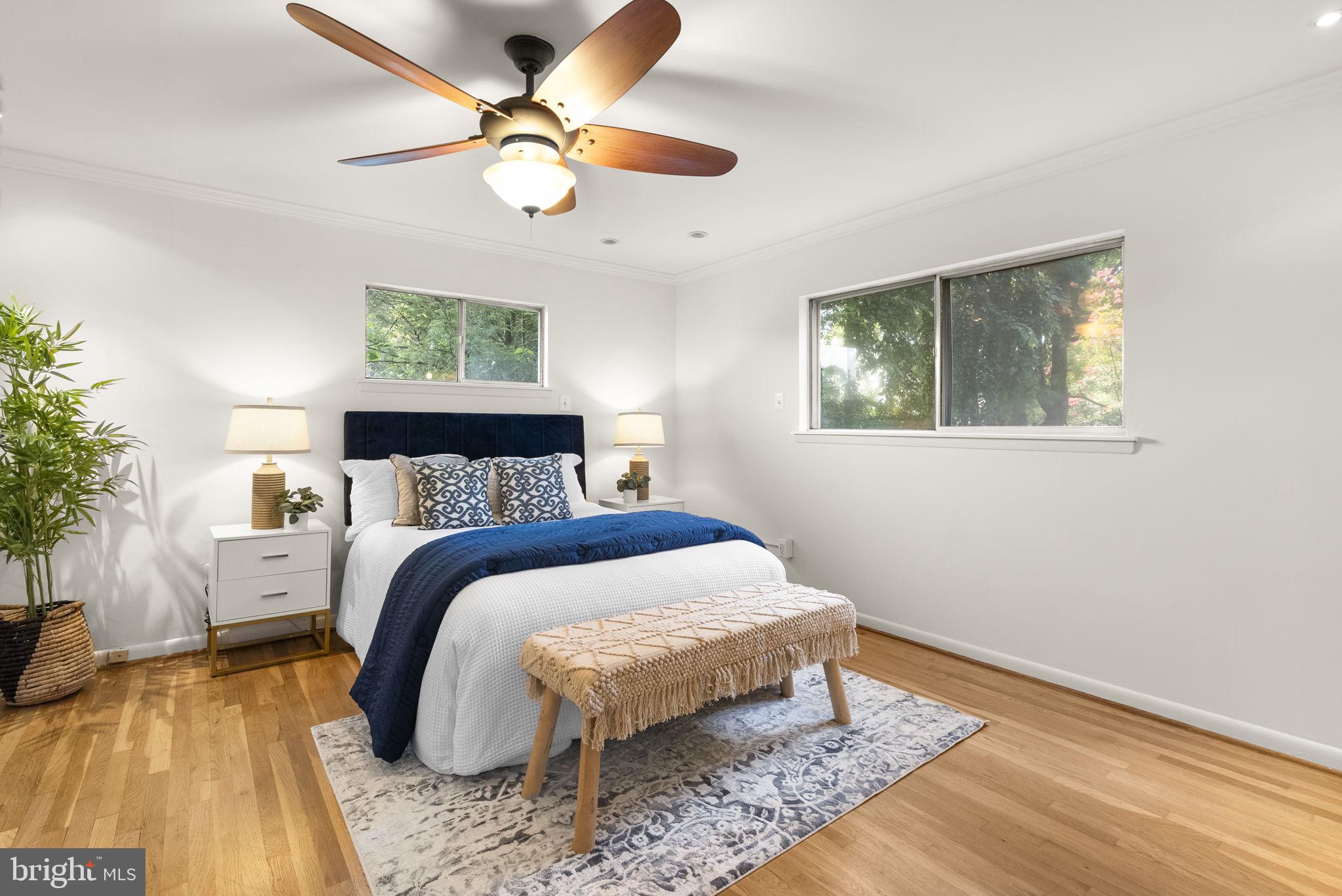 1503 Leister Drive Silver Spring, MD 20904 - Photo 23 of 58 a bedroom with a bed and a chandelier