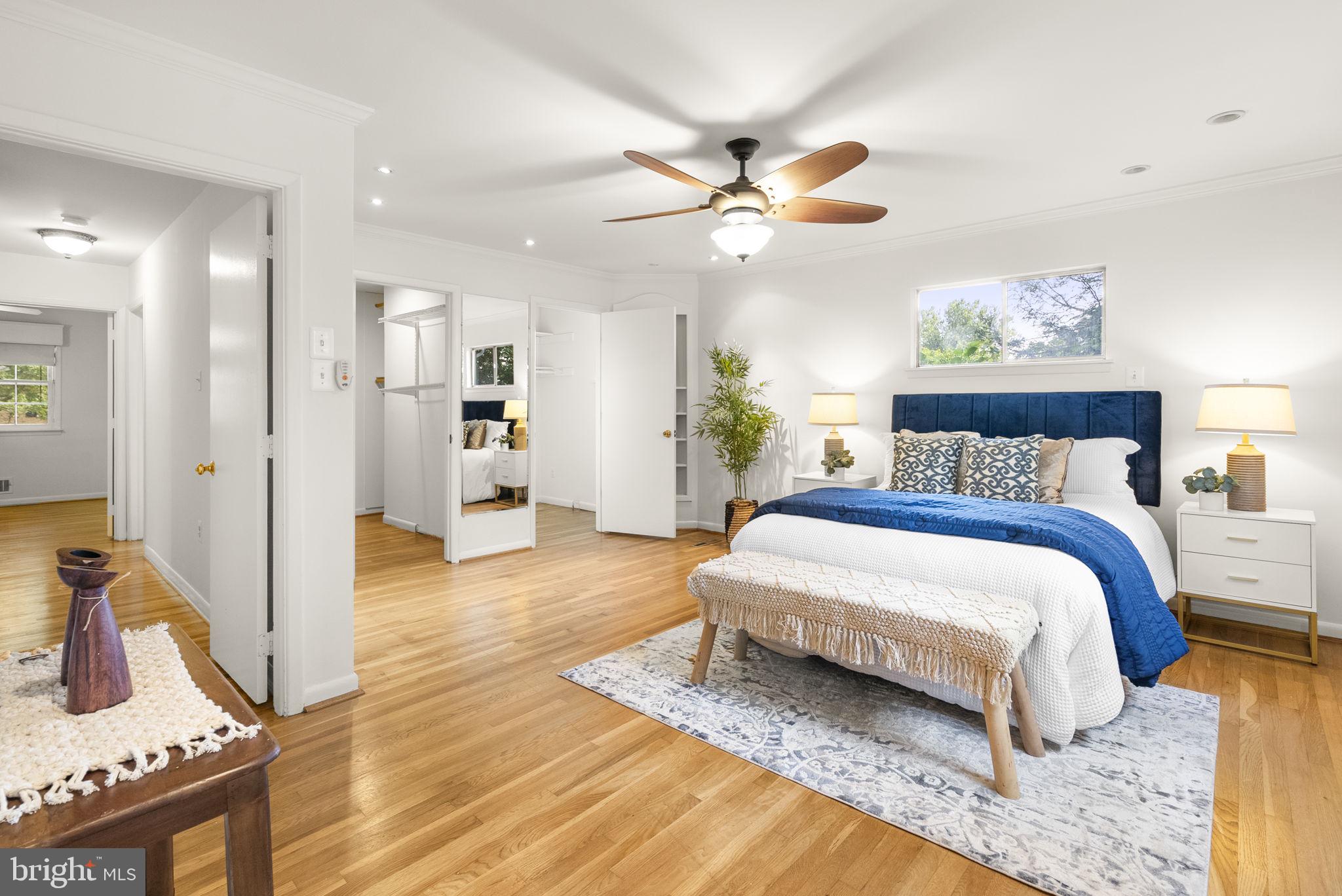 1503 Leister Drive Silver Spring, MD 20904 - Photo 24 of 58 a spacious bedroom with a bed and a chandelier