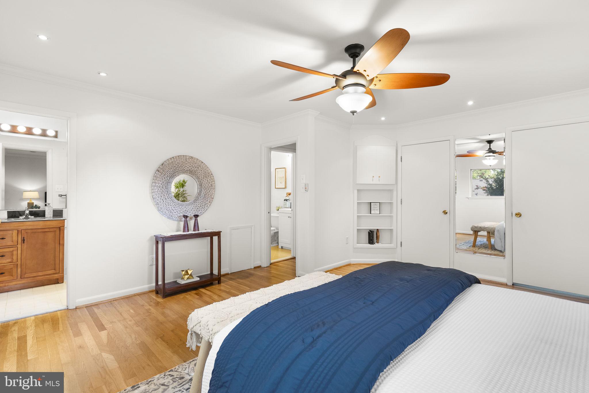 1503 Leister Drive Silver Spring, MD 20904 - Photo 26 of 58 a bedroom with a bed and a chandelier