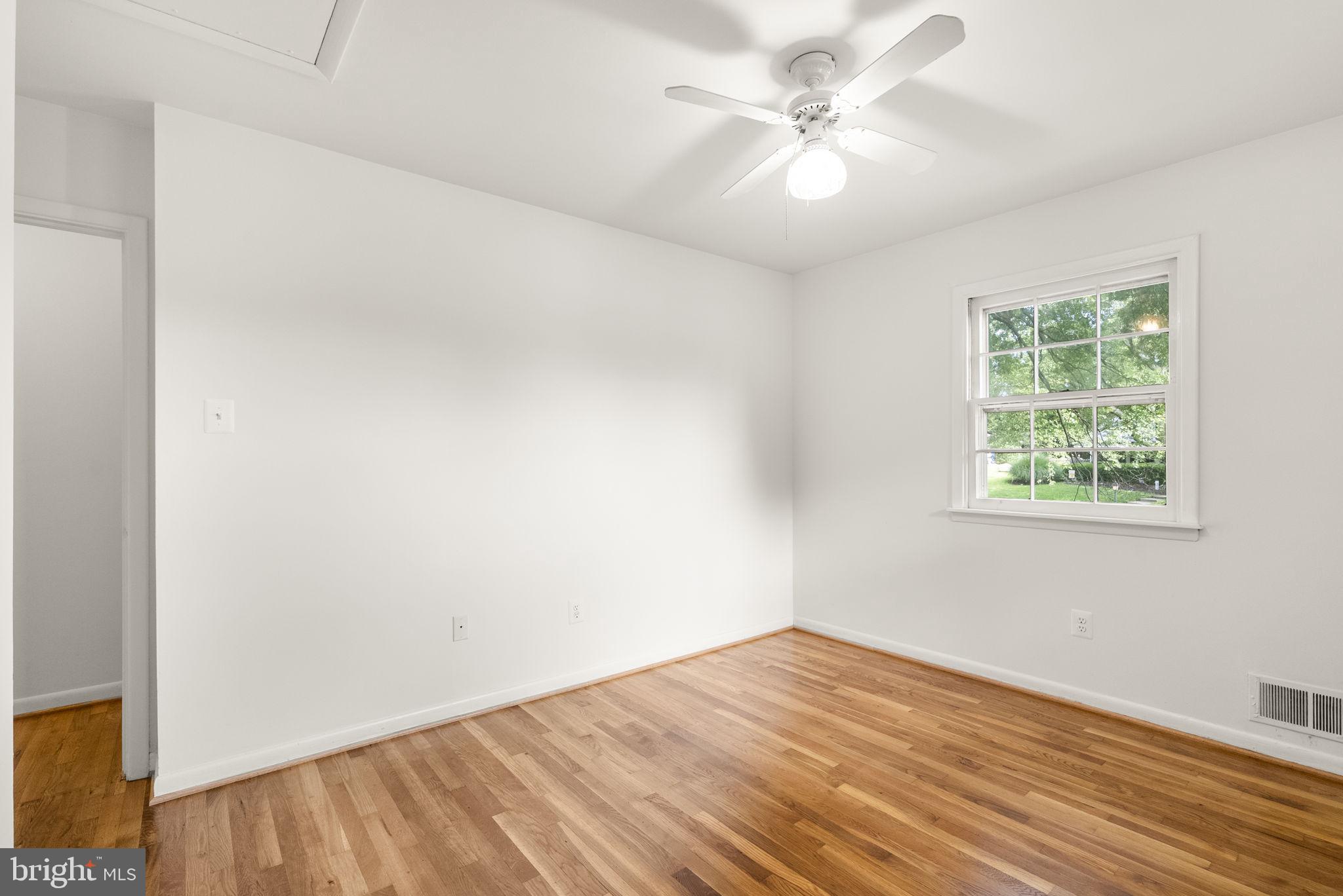 1503 Leister Drive Silver Spring, MD 20904 - Photo 36 of 58 an empty room with a window and a ceiling fan