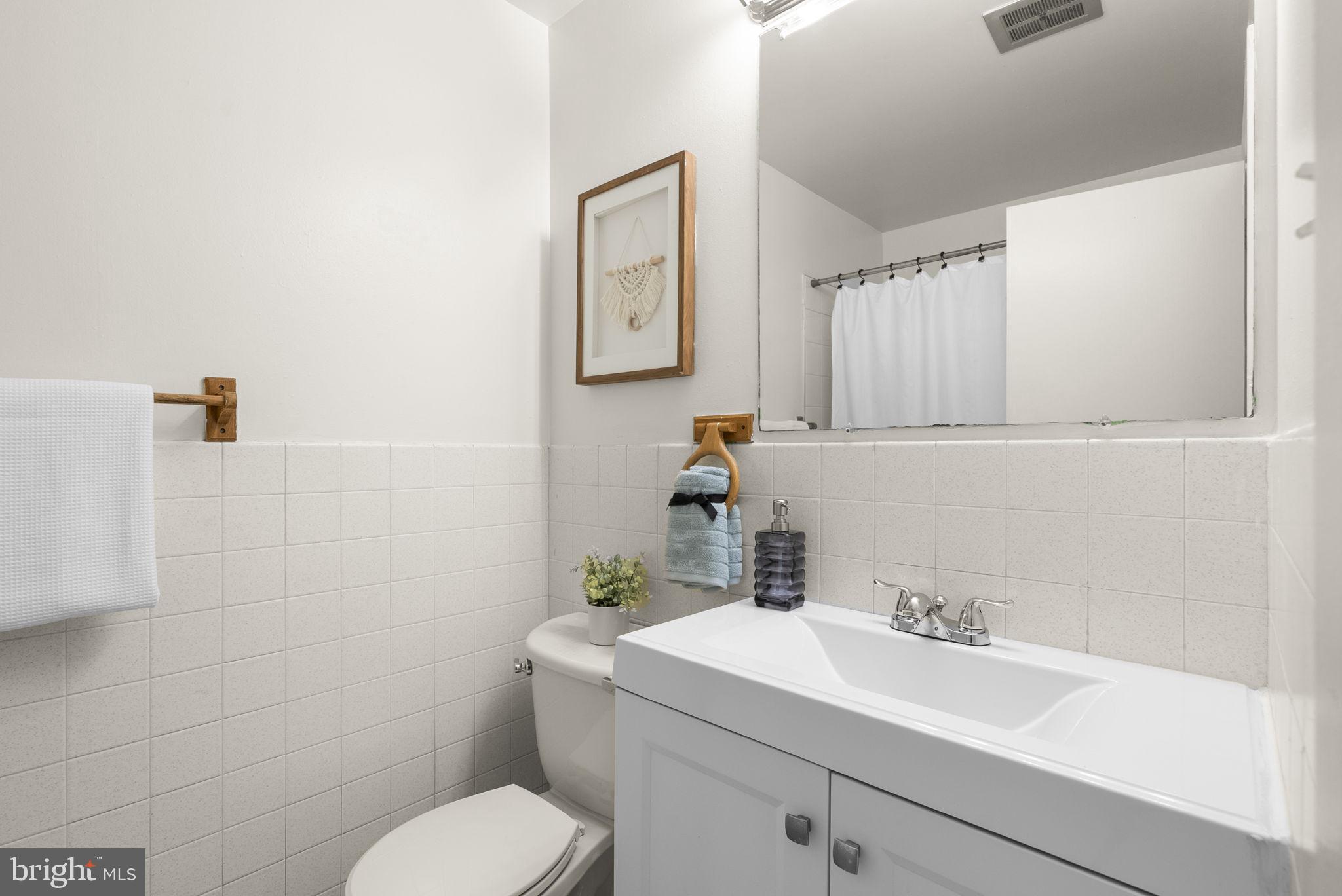 1503 Leister Drive Silver Spring, MD 20904 - Photo 38 of 58 a bathroom with a sink toilet and vanity