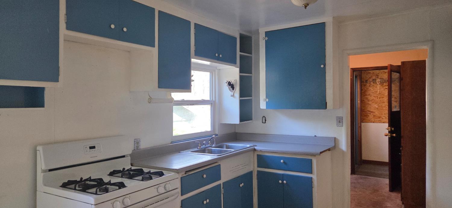 1661 Taylor Road Penryn, CA 95663 - Photo 11 of 16 a kitchen with a stove and cabinets