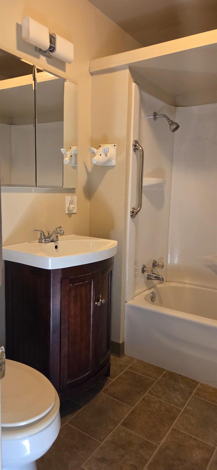 1661 Taylor Road Penryn, CA 95663 - Photo 16 of 16 a bathroom with a sink a toilet and shower