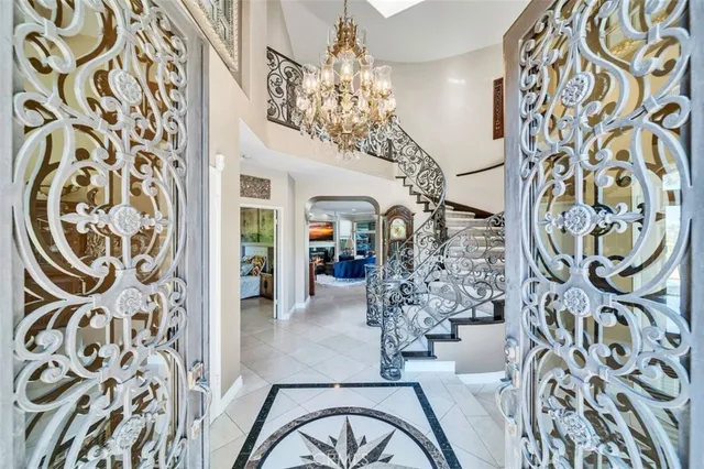a view of a entryway with furniture and a chandelier