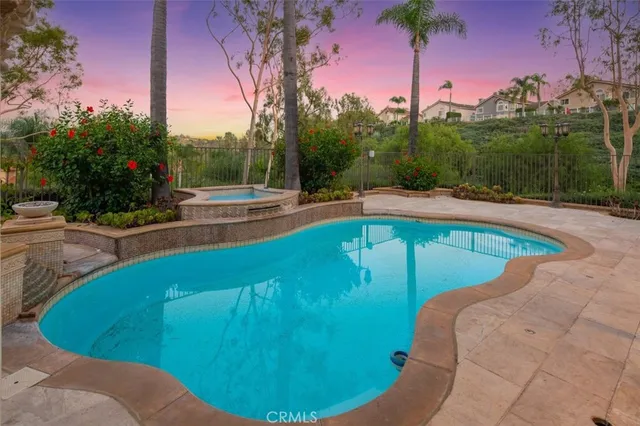 a view of a swimming pool with a yard