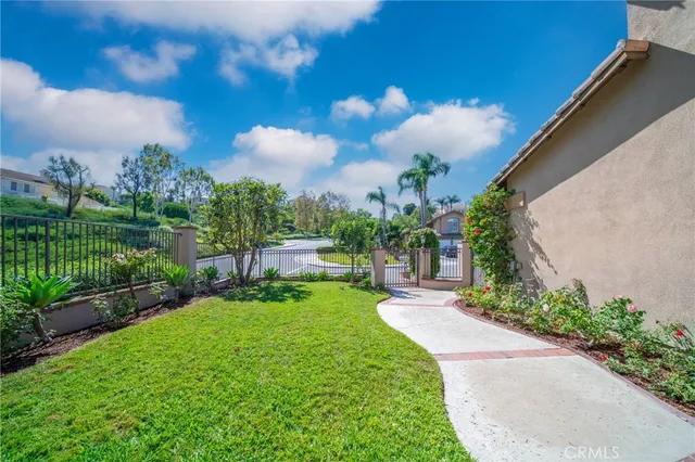 a view of a garden with a building in the background