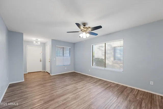 a view of an empty room with a window