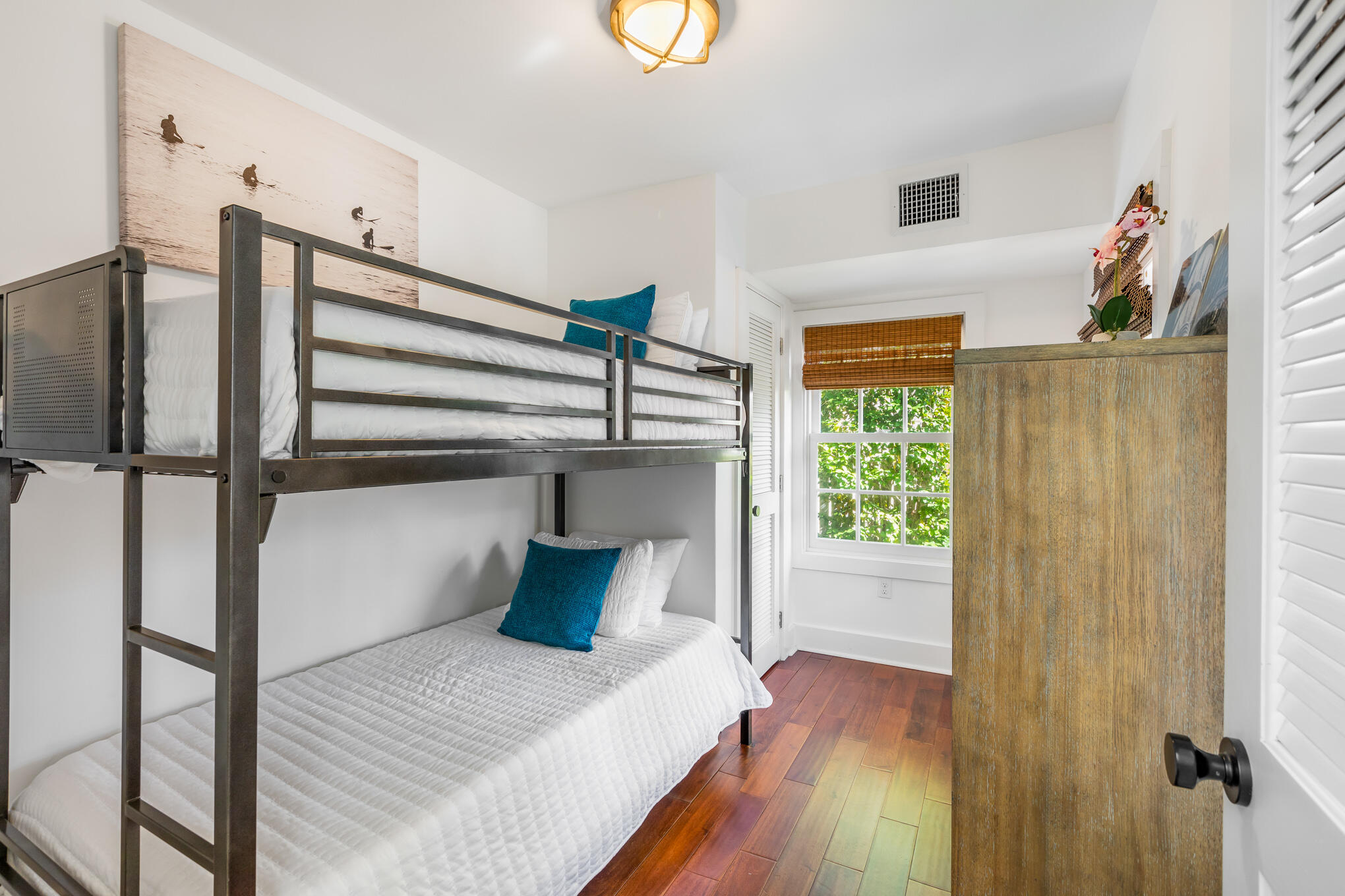 1311 Pine Street Key West, FL 33040 - Photo 18 of 25 a bedroom with a bed and a window