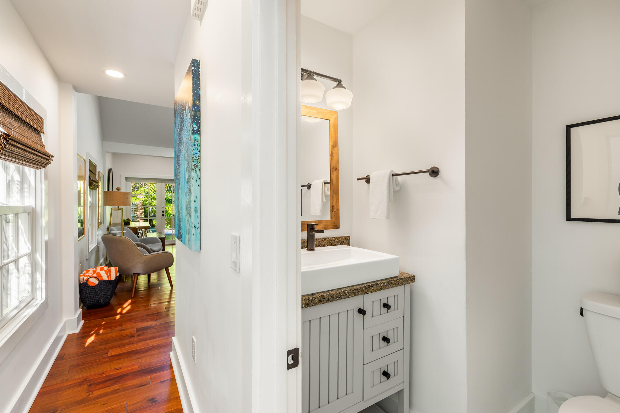 1311 Pine Street Key West, FL 33040 - Photo 19 of 25 a en suite bathroom with a granite countertop sink and a mirror