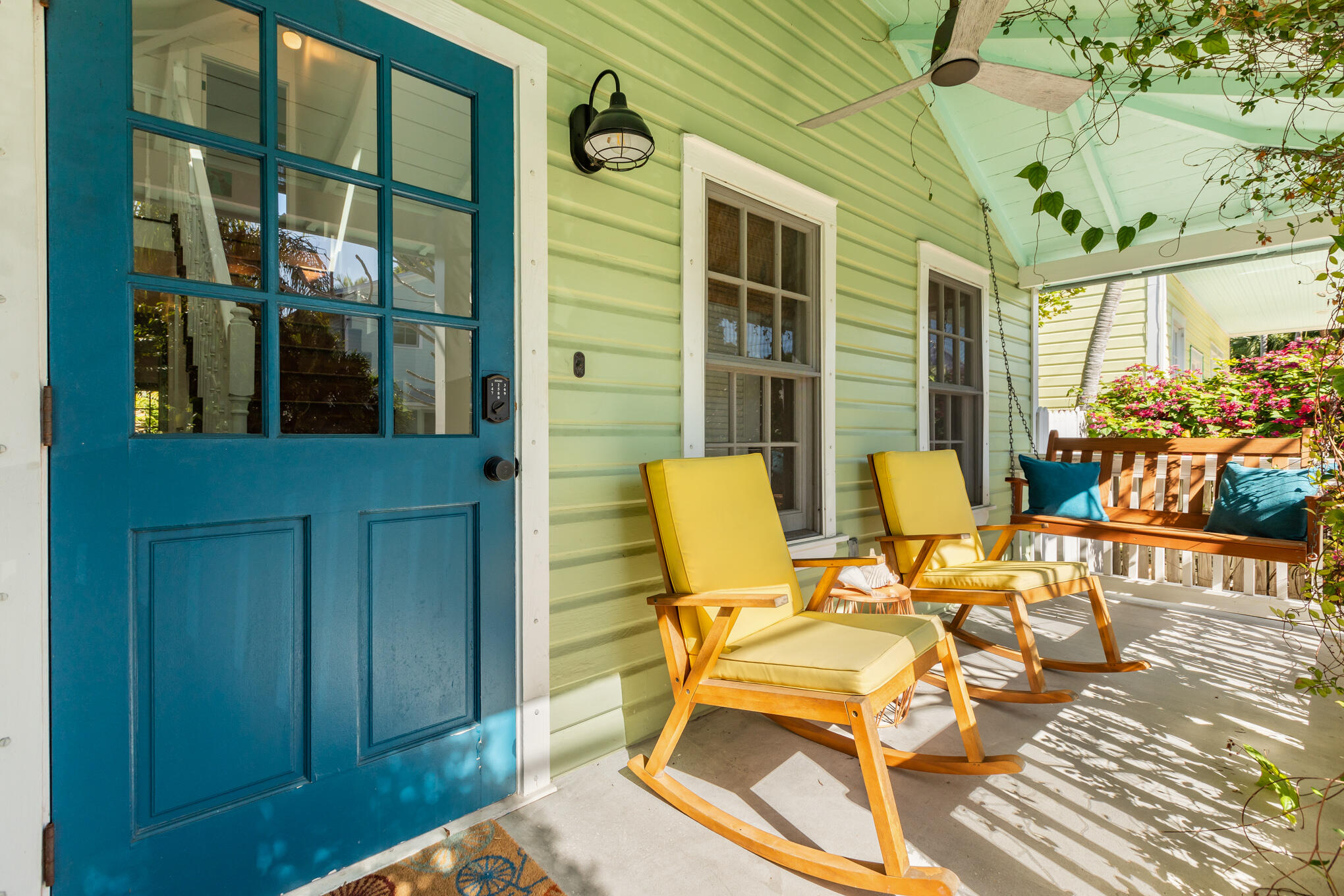 1311 Pine Street Key West, FL 33040 - Photo 2 of 25 a view of a patio with table and chairs and potted plants