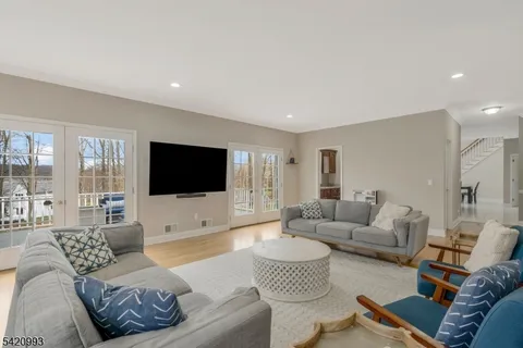 a hallway with sink refrigerator and window