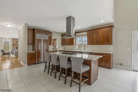 a kitchen with a stove sink and cabinets