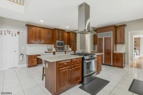 a kitchen with stainless steel appliances granite countertop a sink and cabinets