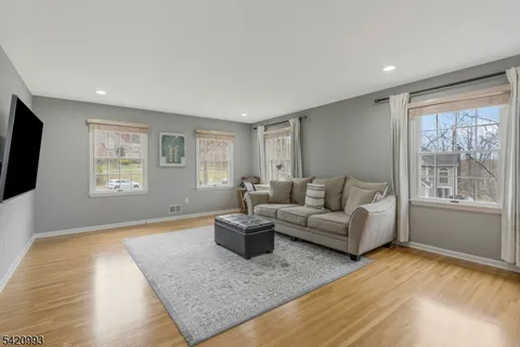 a spacious bedroom with a bed and a window