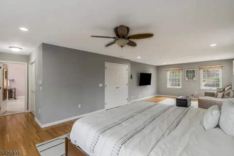 a bathroom with a tub shower and sink