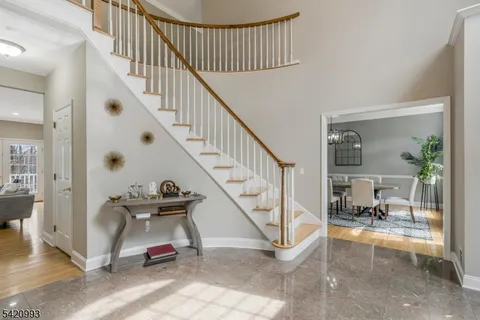 a living room with furniture a rug and a window