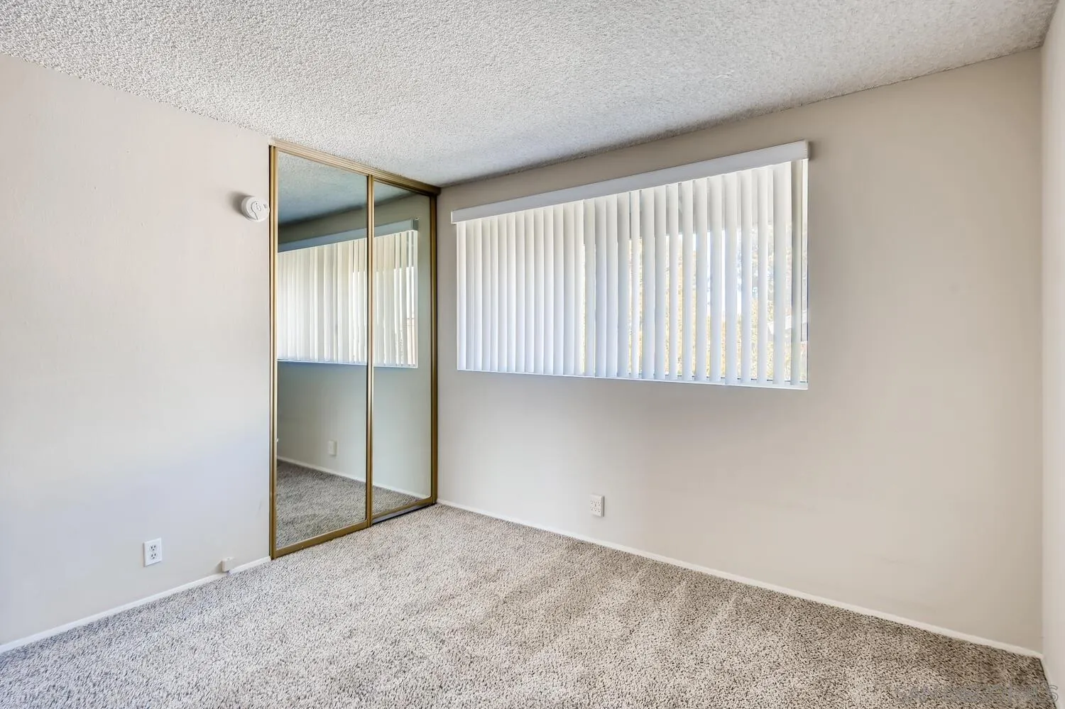 8271 Caminito Modena San Diego, CA 92037 - Photo 11 of 28 an empty room with a empty space and windows
