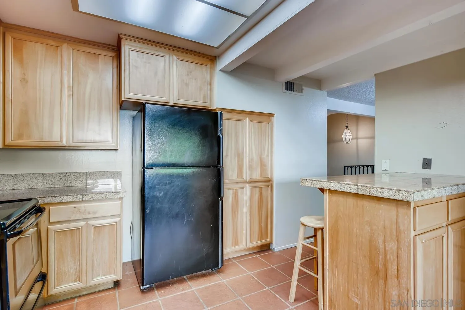 8271 Caminito Modena San Diego, CA 92037 - Photo 24 of 28 a kitchen with stainless steel appliances granite countertop a refrigerator and a stove
