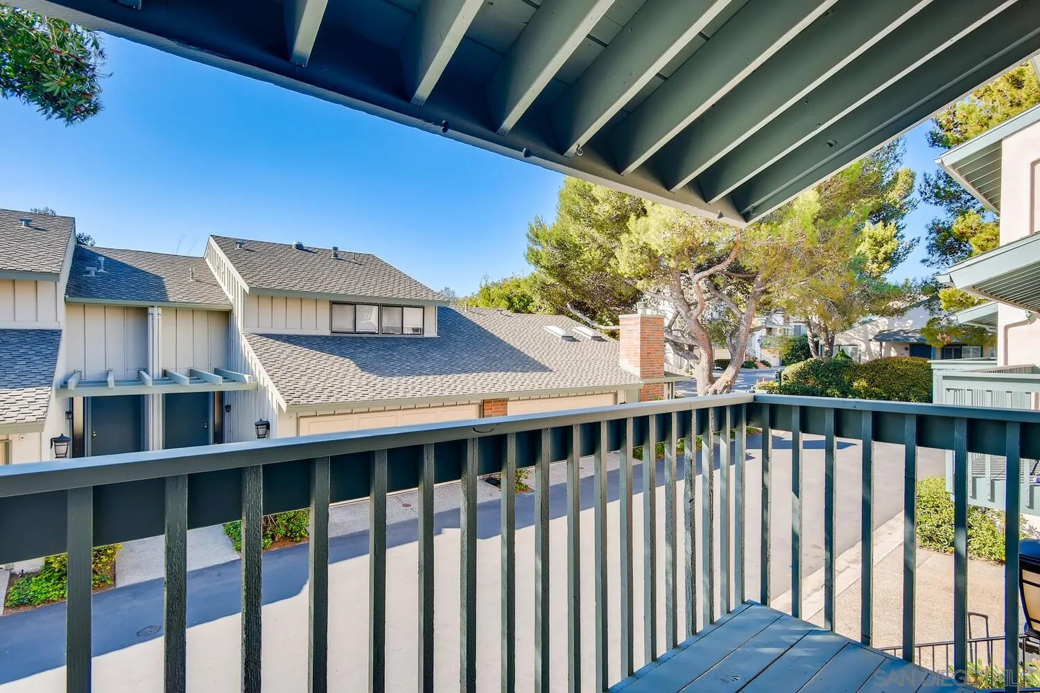 8271 Caminito Modena San Diego, CA 92037 - Photo 5 of 28 a view of a balcony with wooden floor