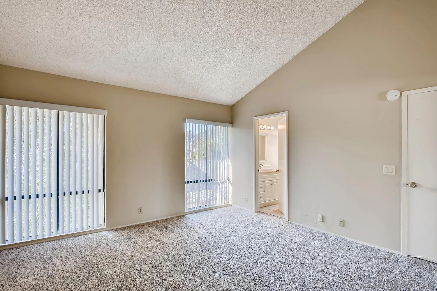 8271 Caminito Modena San Diego, CA 92037 - Photo 7 of 28 an empty room with windows
