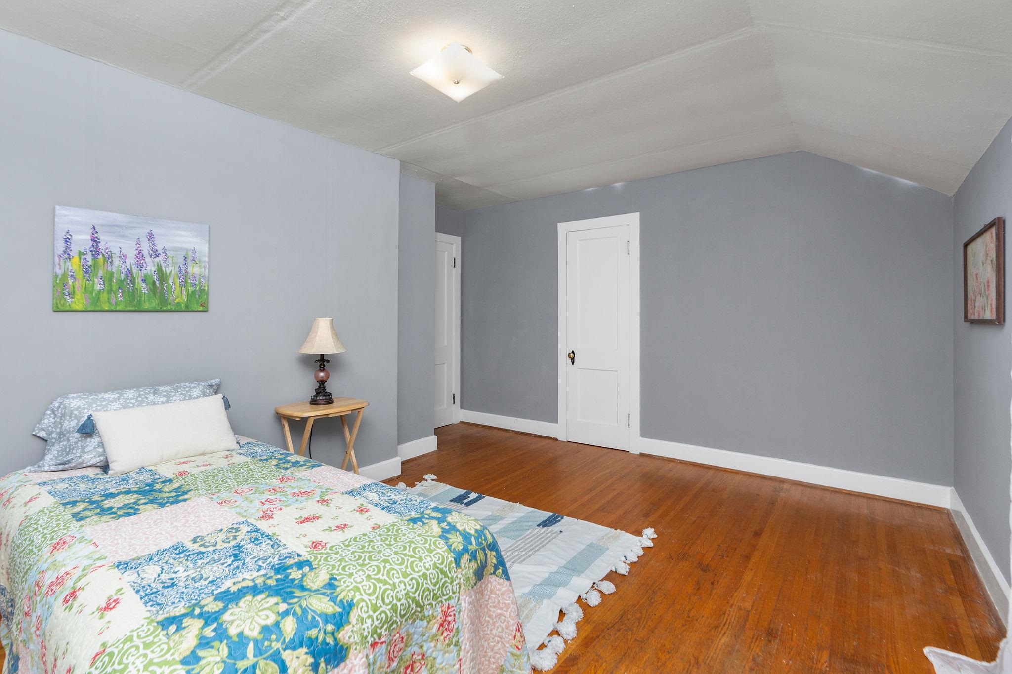 712 Nelson Street Staunton, VA 24401 - Photo 21 of 30 a bedroom with a bed and a painting on the wall