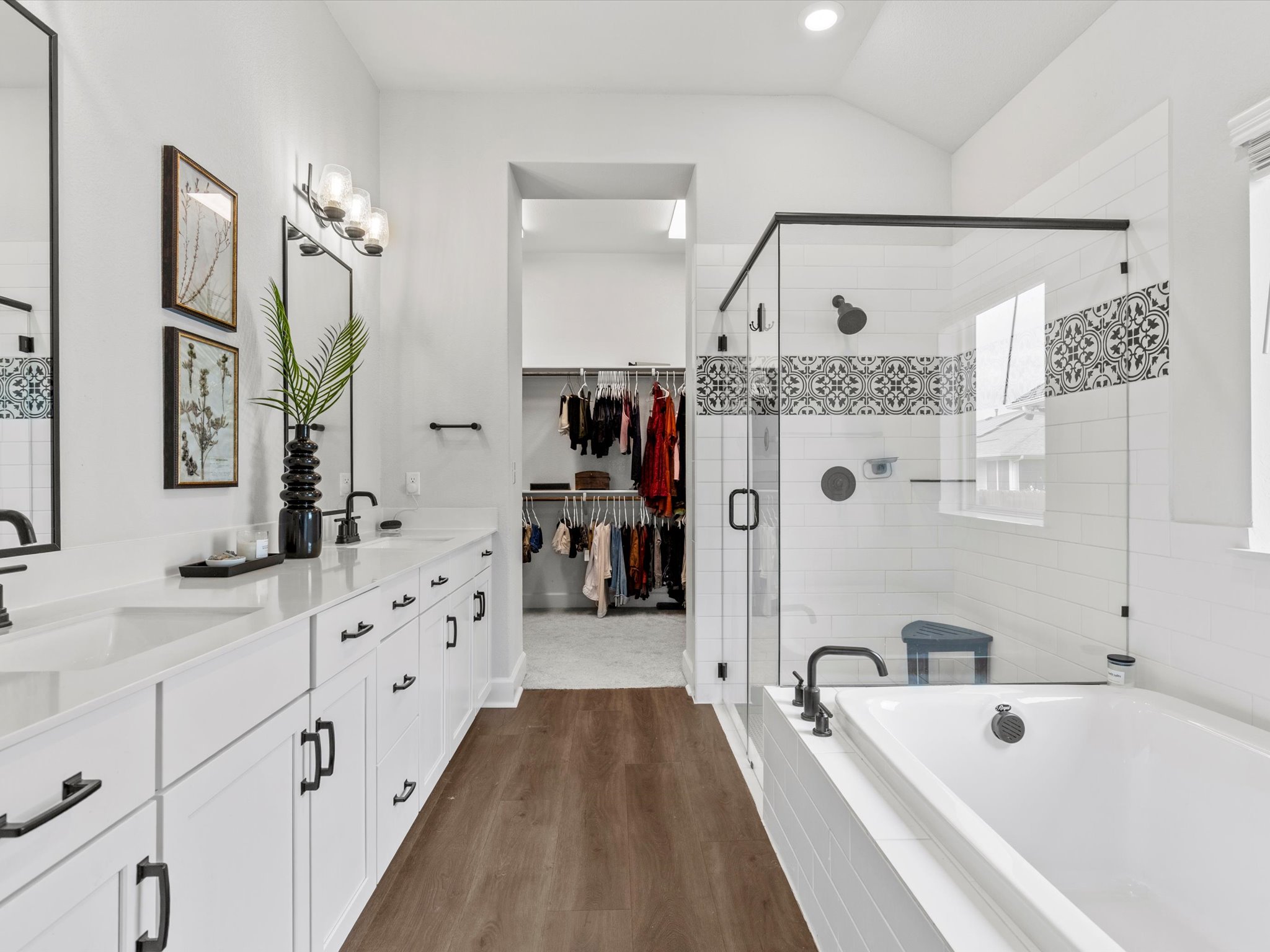 9001 Centurion Path Austin, TX 78744 - Photo 16 of 40 a bathroom with a bathtub a sink and a mirror