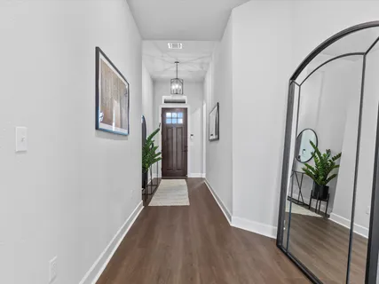 a room that has a rug and a window