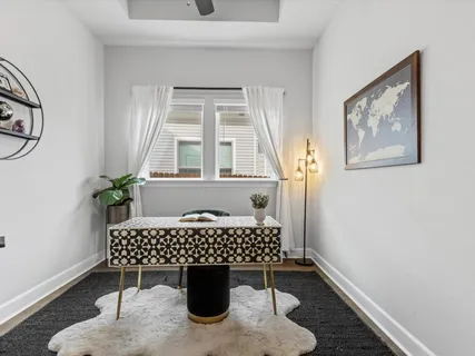a bathroom with a bathtub a sink and a mirror