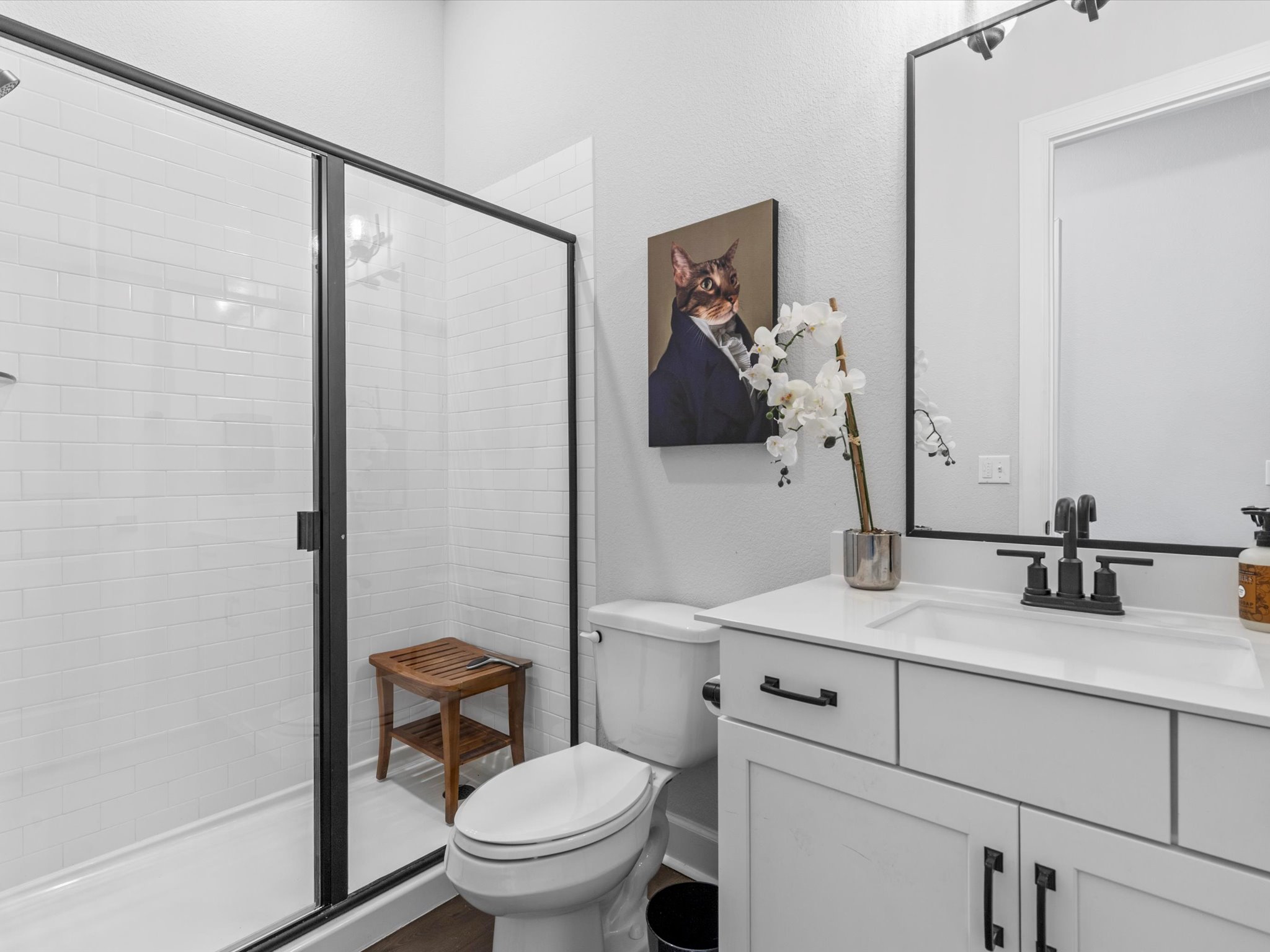 9001 Centurion Path Austin, TX 78744 - Photo 25 of 40 a bathroom with a toilet sink and mirror