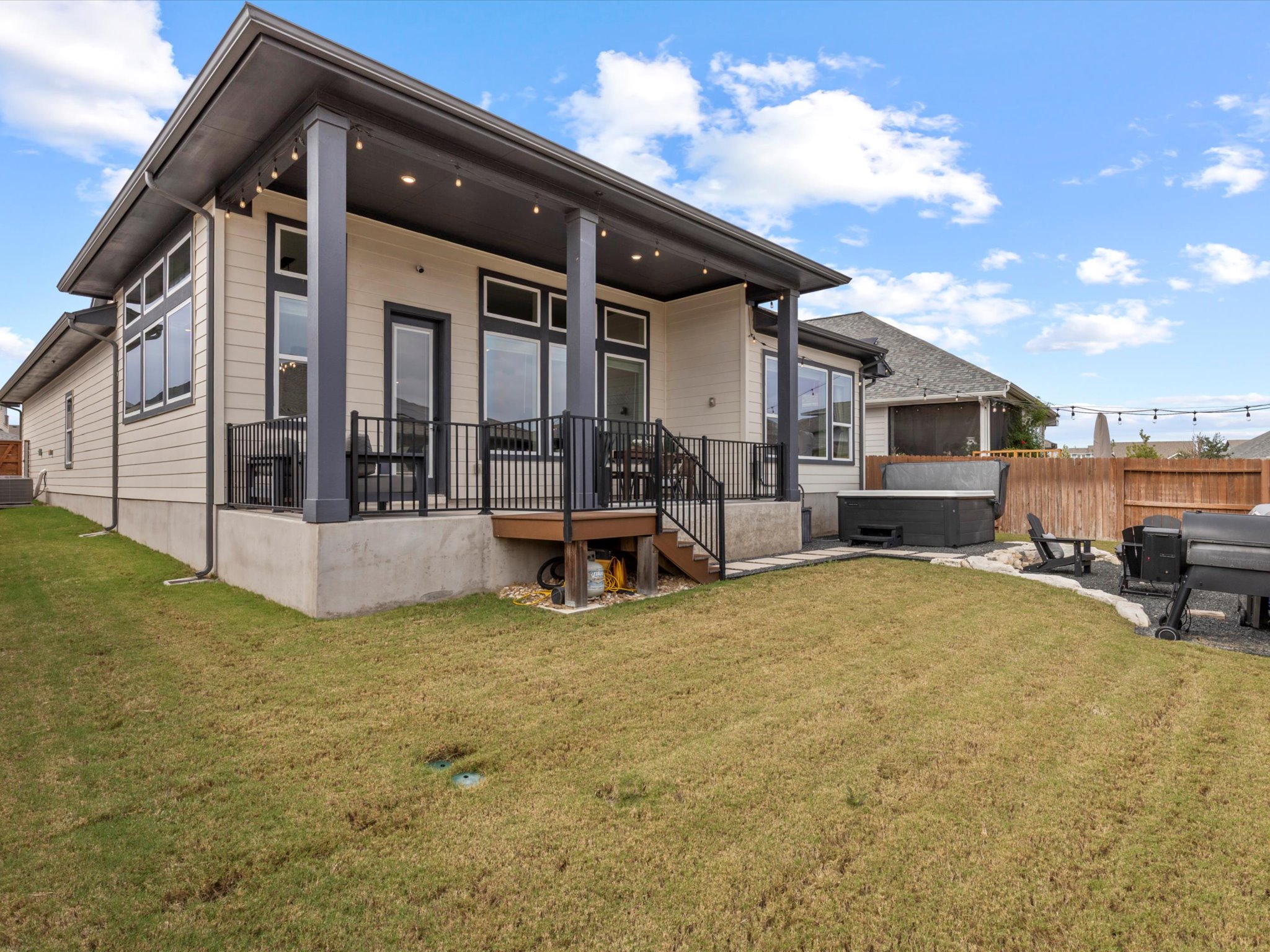 9001 Centurion Path Austin, TX 78744 - Photo 32 of 40 a view of a house with a patio