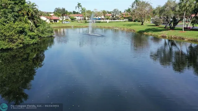 a view of a lake with houses with outdoor space