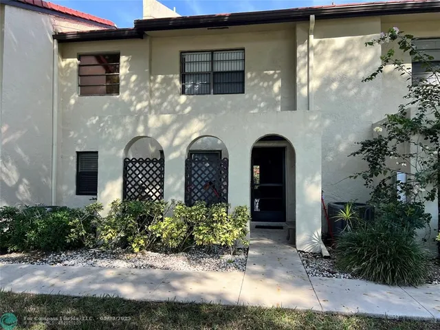 a swimming pool with outdoor seating yard and barbeque oven