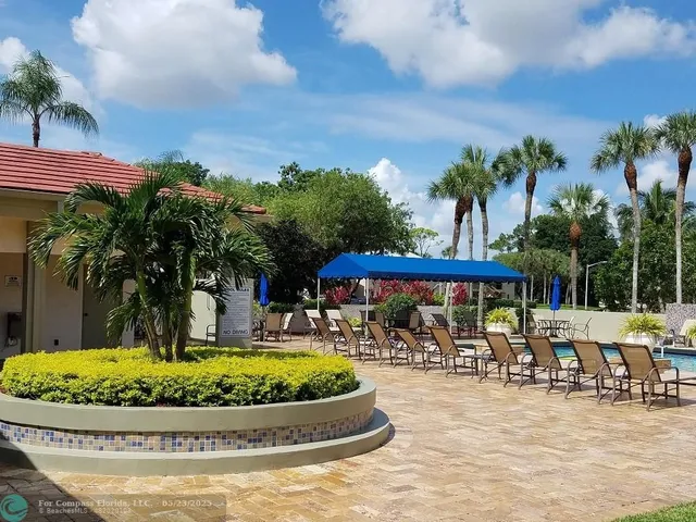 an aerial view of multiple houses with yard