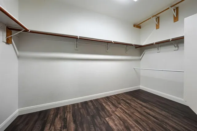 a view of a livingroom with furniture and a flat screen tv