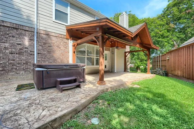 an aerial view of a house with a yard basket ball court and outdoor seating